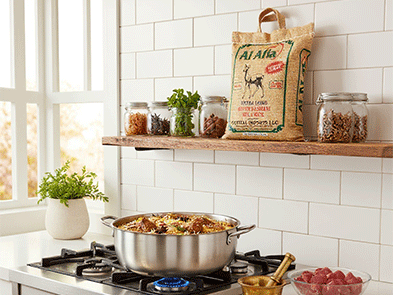 Traditional mutton biryani served with Al Afia Rice on a plate